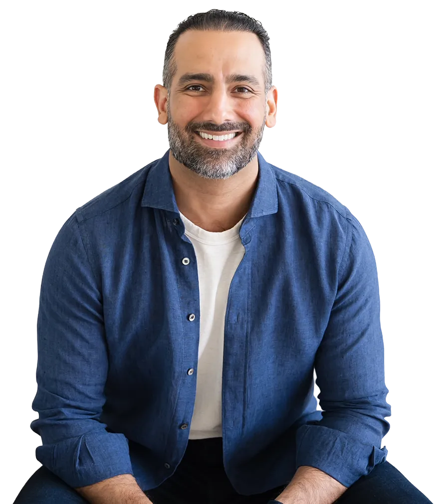 Ali Nasser, founder of WISE, seated portrait
