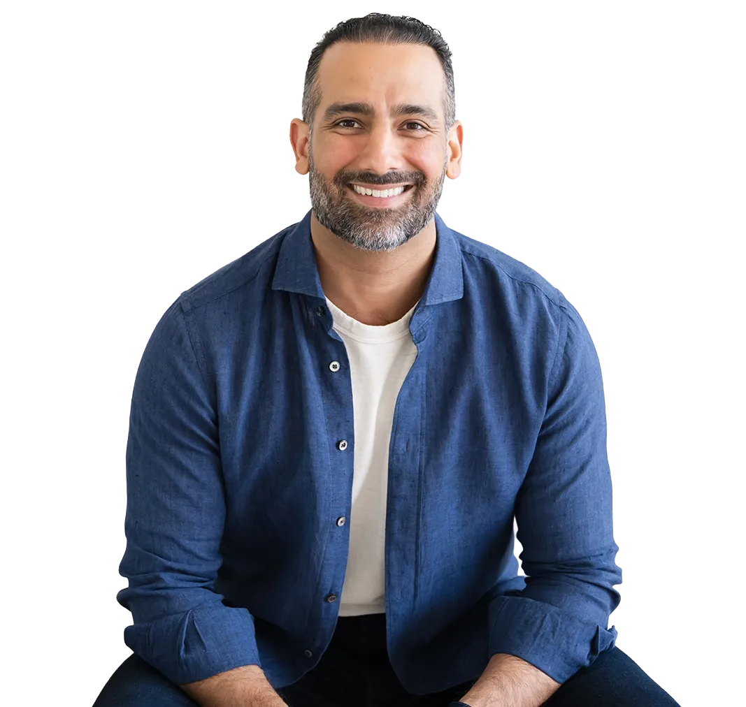 Ali Nasser, founder of WISE, seated portrait