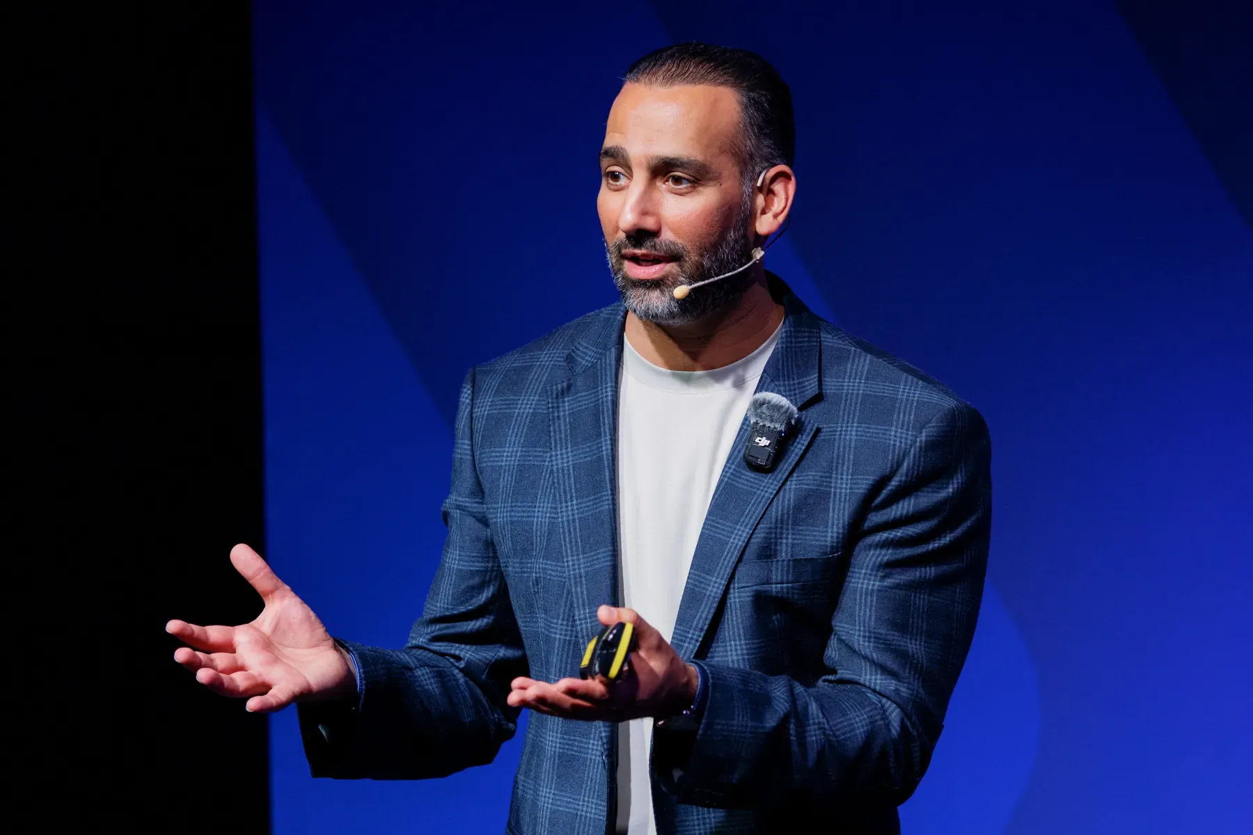 Ali Nasser mid-talk on stage